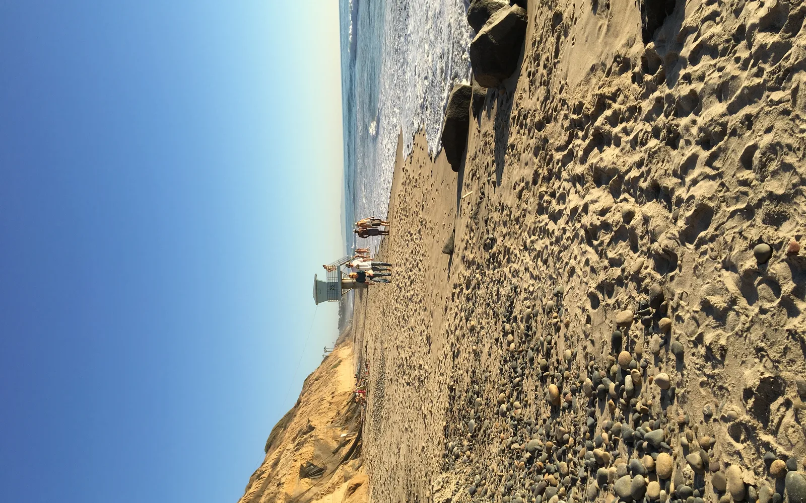 Carlsbad State Beach with sandy shoreline and coastal bluffs in background